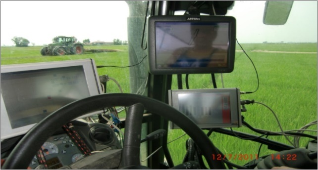 The tractor’s cab full of monitors and cables, due to the lack of communication between monitors and sensors of different brands