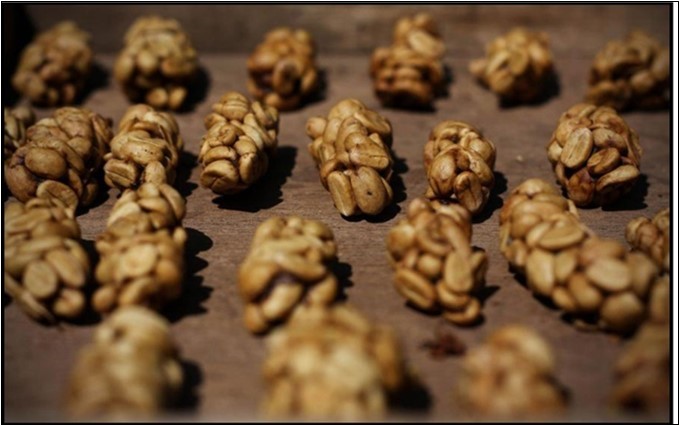 Kopi luwak: From coffee cherries, eaten and defecated by the Asian palm civet {The guardian 2003: In China the civet cat is a delicacy - and may have caused SARS. {https://www.theguardian.com/world/2003/may/24/china.sars}