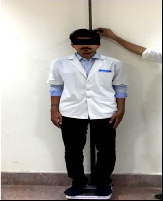 Measurement of Height (cm) from the sole of the feet to the vertex of the head using Stadiometer.